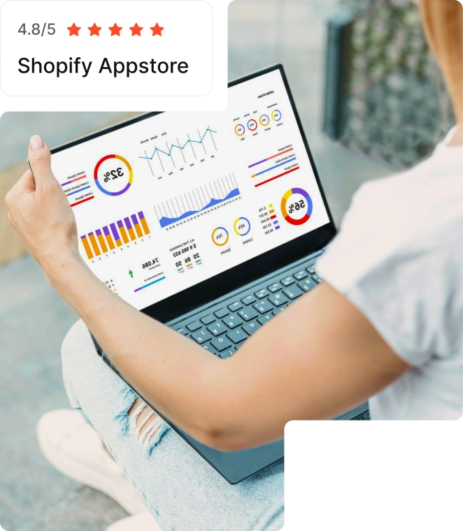 Woman analyzes data graphs on laptop screen.