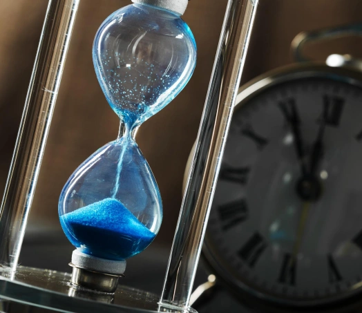 Hourglass with blue sand